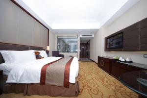 Voodi või voodid majutusasutuse Shenzhen Avant-Garde Hotel toas