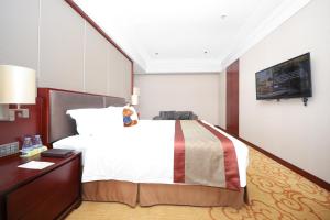 Voodi või voodid majutusasutuse Shenzhen Avant-Garde Hotel toas