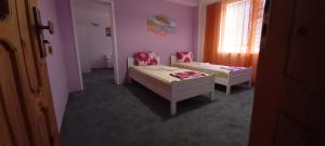 Postel nebo postele na pokoji v ubytování Guesthouse Flora