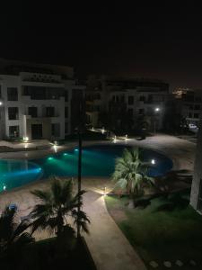 a view of a swimming pool at night at Hivernage in Agadir