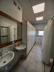 a bathroom with two sinks and a large mirror at Air Tel Home in Radom +11 photos