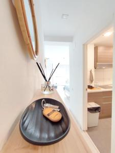 a black object on a counter in a kitchen at Las Canteras Suite in Las Palmas de Gran Canaria