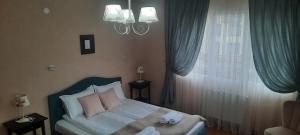 Postel nebo postele na pokoji v ubytování Infinity Boutique Apartments
