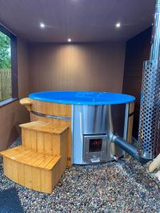 a patio with a table and a fire place at Lovely 1-Bed House in Fochabers Scotland in Fochabers