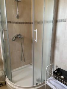 a shower with a glass door in a bathroom at Sea view apartment near the beach S2-Jelsa center in Jelsa
