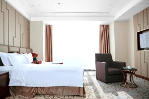 Voodi või voodid majutusasutuse Shenzhen Avant-Garde Hotel toas