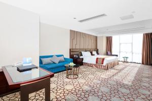 Voodi või voodid majutusasutuse Shenzhen Avant-Garde Hotel toas