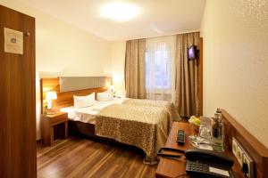 Hotel Frankfurt Messe客房内的一张或多张床位