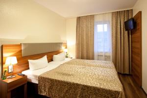 Hotel Frankfurt Messe客房内的一张或多张床位