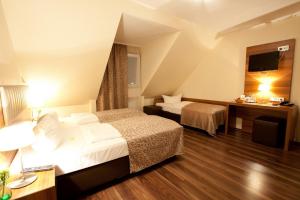 Hotel Frankfurt Messe客房内的一张或多张床位