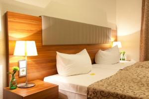 Hotel Frankfurt Messe客房内的一张或多张床位