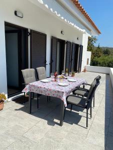 a table and chairs sitting on a patio at Casa di Vati in Vátion