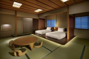 Letto o letti in una camera di Kawana Hotel