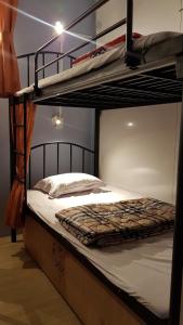 a couple of bunk beds in a room at Sky House Hostel in Ho Chi Minh City