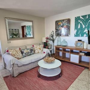 a living room with a couch and a table at Independent two beedrooms house with sea views in Santa Cruz de Tenerife