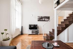Televízia a/alebo spoločenská miestnosť v ubytovaní Perfectday1 Budapest