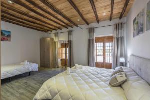 Postel nebo postele na pokoji v ubytování Casa Rural Maimones + 37 fotografií