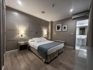 Posteľ alebo postele v izbe v ubytovaní Hotel Doña Blanca
