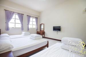 Postel nebo postele na pokoji v ubytování Tian Mama Homestay