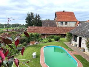 a swimming pool in the yard of a house at Pool-Zimmer in Schnackenburg in Schnackenburg