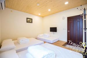 Postel nebo postele na pokoji v ubytování Tian Mama Homestay