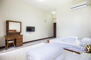 Postel nebo postele na pokoji v ubytování Tian Mama Homestay