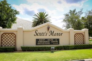 a building with a sign for a scotts marker at Scott's Manor Guesthouse Function and Conference Venue in Lichtenburg