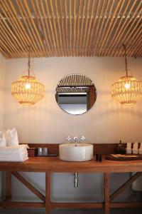 a bathroom with a sink and two lights at The Mak Trat in Ko Mak +16 photos