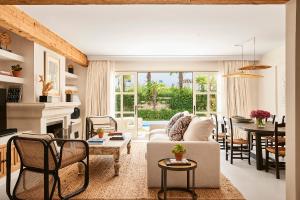 a living room with a couch and a table at Marbella Club Hotel · Golf Resort & Spa in Marbella