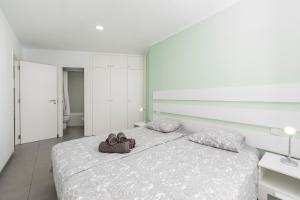 A bed or beds in a room at MEDANO4YOU La Terraza Los Martines