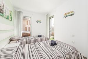 A bed or beds in a room at MEDANO4YOU La Terraza Los Martines