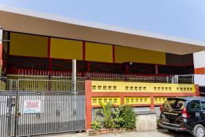 a car parked in front of a building at SPOT ON 91159 Kost Putrana Syariah in Cilimus 2