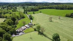 an aerial view of a farm with a group of homes at Green Grove Country House in Malham