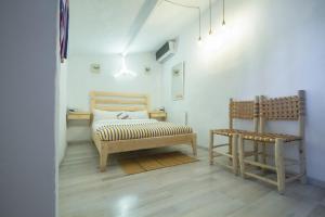 Ένα ή περισσότερα κρεβάτια σε δωμάτιο στο USHA Guest House