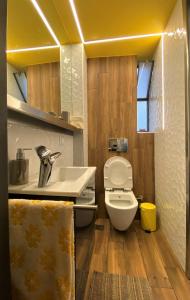 a bathroom with a sink and a toilet at Dreamy Central Corner in Thessaloniki