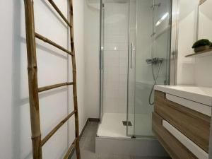 a shower with a glass door in a bathroom at Deux pièces rénové avec terrasse, parking privé à Port Camargue - FR-1-250-173 in Saint-Mélany +14 photos