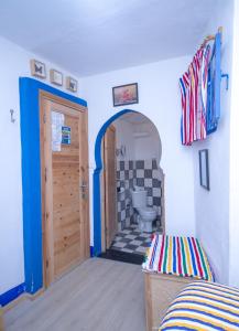 Ένα ή περισσότερα κρεβάτια σε δωμάτιο στο USHA Guest House