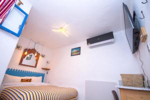 Μια τηλεόραση ή/και κέντρο ψυχαγωγίας στο USHA Guest House