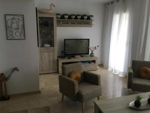TV a/nebo společenská místnost v ubytování Mistral