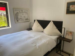 Katil atau katil-katil dalam bilik di Ferienhaus Strandbadallee