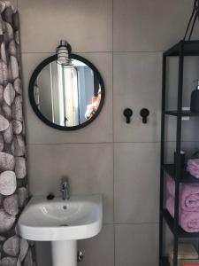 a bathroom with a sink and a mirror at Villa Isla Plana, right by the sea - Grande in Isla Plana