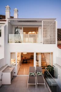 a view of a house with two chairs at Casa Nova in Silves