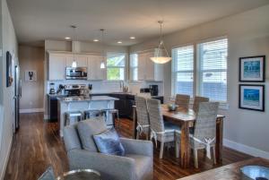 a kitchen and living room with a table and chairs at Sea Turtle Cottage in Ocean Shores