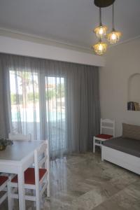Posteľ alebo postele v izbe v ubytovaní Maria Suites
