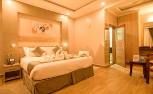 Postel nebo postele na pokoji v ubytování Abai Lodges & Spa