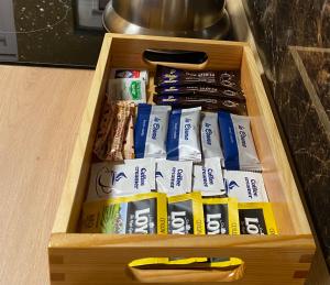 a wooden drawer filled with different types of food at Mazurski Domek in Mikołajki