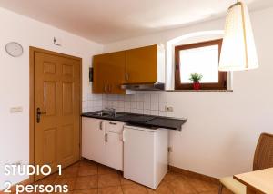 Kuchyň nebo kuchyňský kout v ubytování Glamour Apartments Vrsar