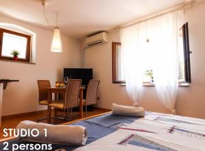 TV a/nebo společenská místnost v ubytování Glamour Apartments Vrsar