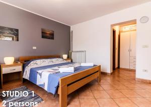 Postel nebo postele na pokoji v ubytování Glamour Apartments Vrsar