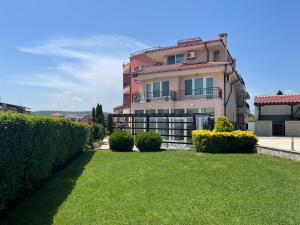 a large house with a lawn in front of it at Villa Mia in Sozopol